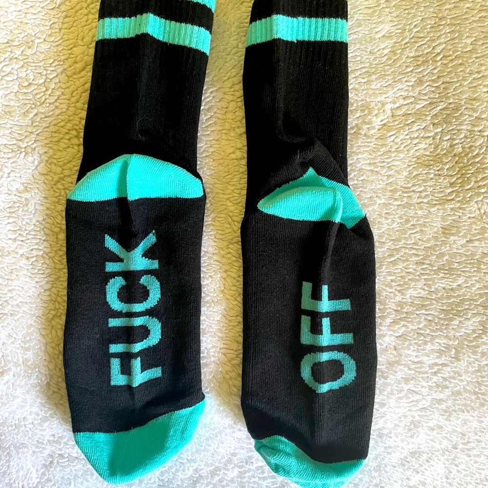 New in package “F*ck Off” socks. Womens size 5-9. Black with blue.